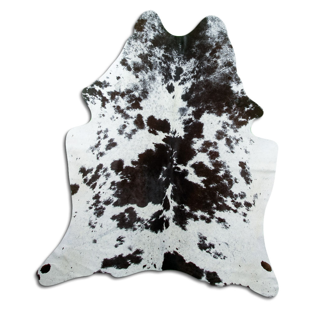 Black and white cowhide rug of about 180 × 160 cm, seen from above: the exact hide you receive