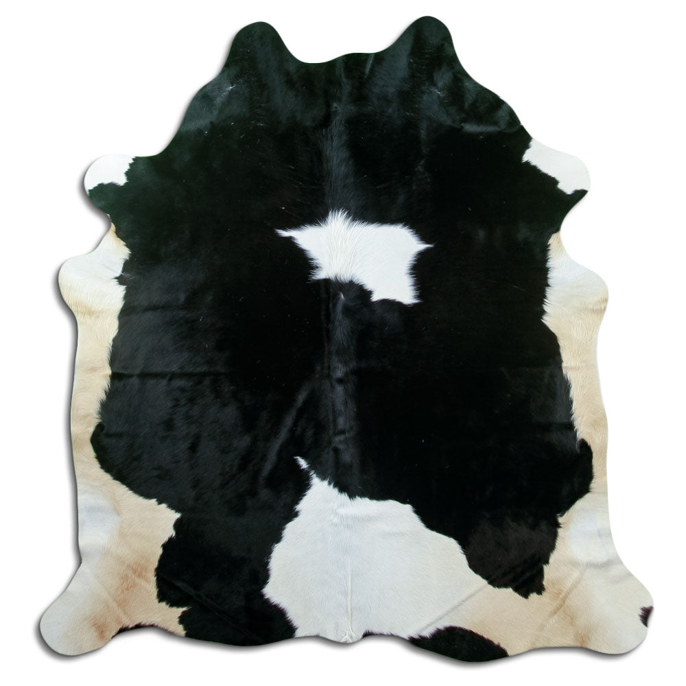 Black and white cowhide rug of about 190 × 180 cm, seen from above: the exact hide you receive