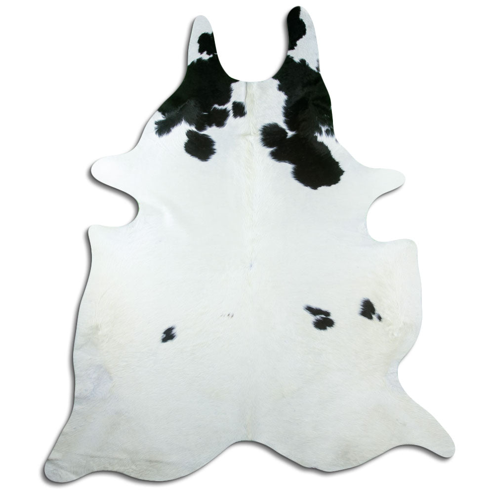 Black and white cowhide rug of about 240 × 210 cm, seen from above: the exact hide you receive