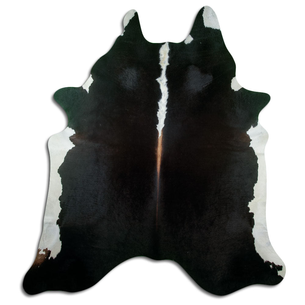 Black and white cowhide rug of about 220 × 200 cm, seen from above: the exact hide you receive