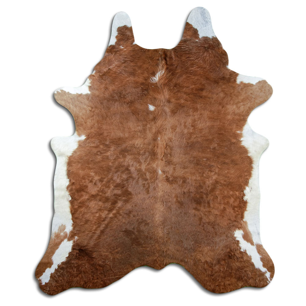 Brown and white cowhide rug of about 230 × 190 cm, seen from above: the exact hide you receive