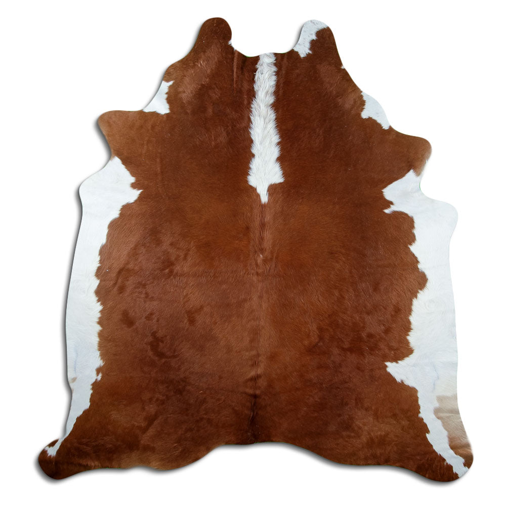 Brown and white cowhide rug of about 220 × 200 cm, seen from above: the exact hide you receive