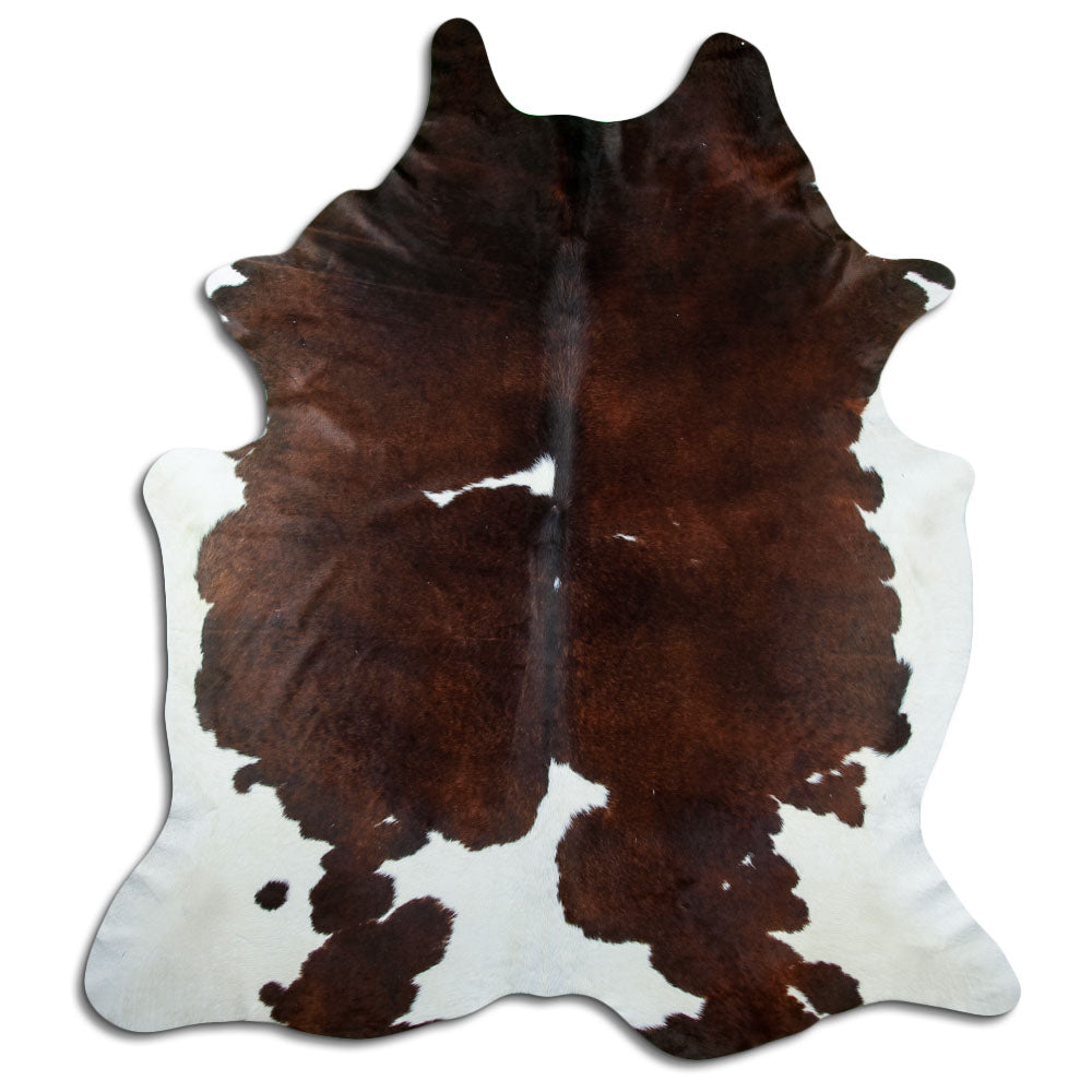 Brown and white cowhide rug of about 240 × 220 cm, seen from above: the exact hide you receive