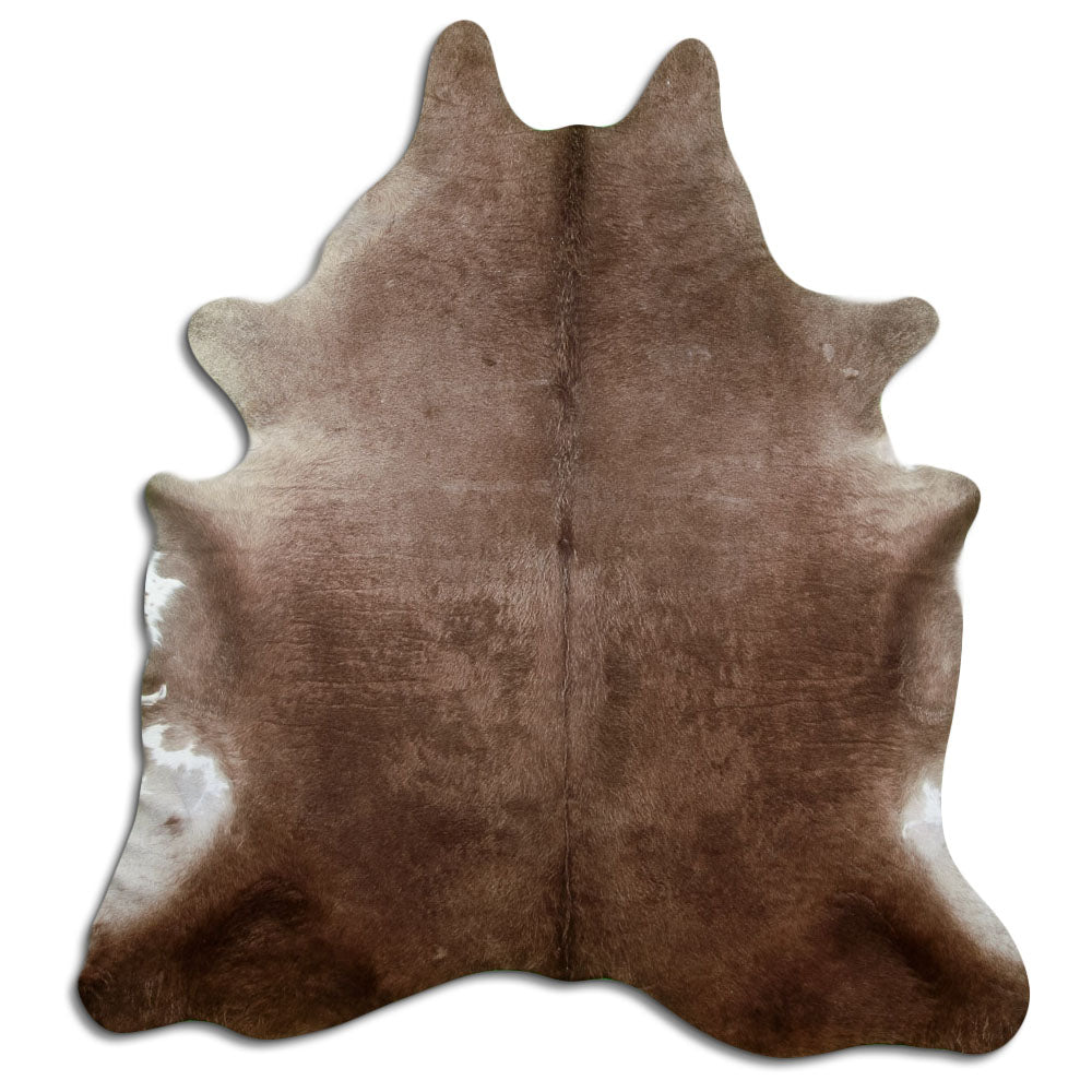 Champagne cowhide rug of about 220 × 200 cm, seen from above: the exact hide you receive