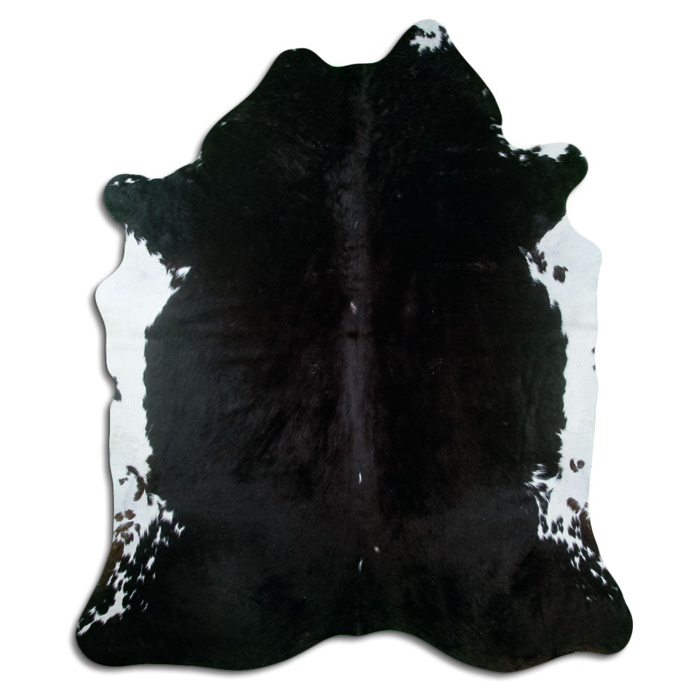 Black cowhide rug of about 210 × 180 cm, seen from above: the exact hide you receive