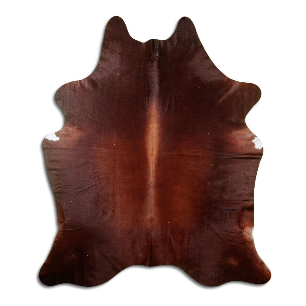 Brown cowhide rug of about 210 × 180 cm, seen from above: the exact hide you receive