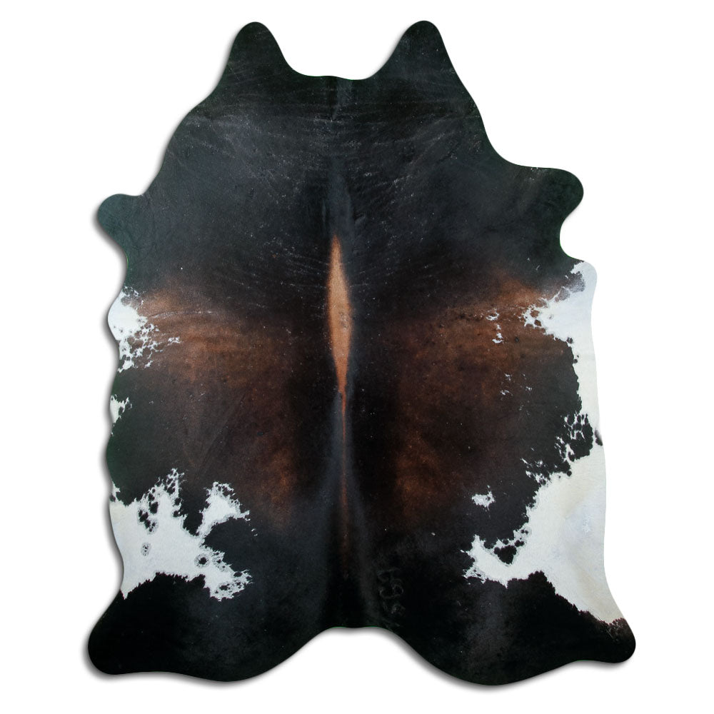 Brown cowhide rug of about 220 × 180 cm, seen from above: the exact hide you receive