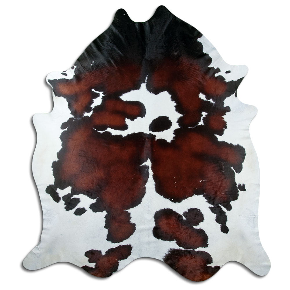 Tricolour cowhide rug of about 250 × 220 cm, seen from above: the exact hide you receive