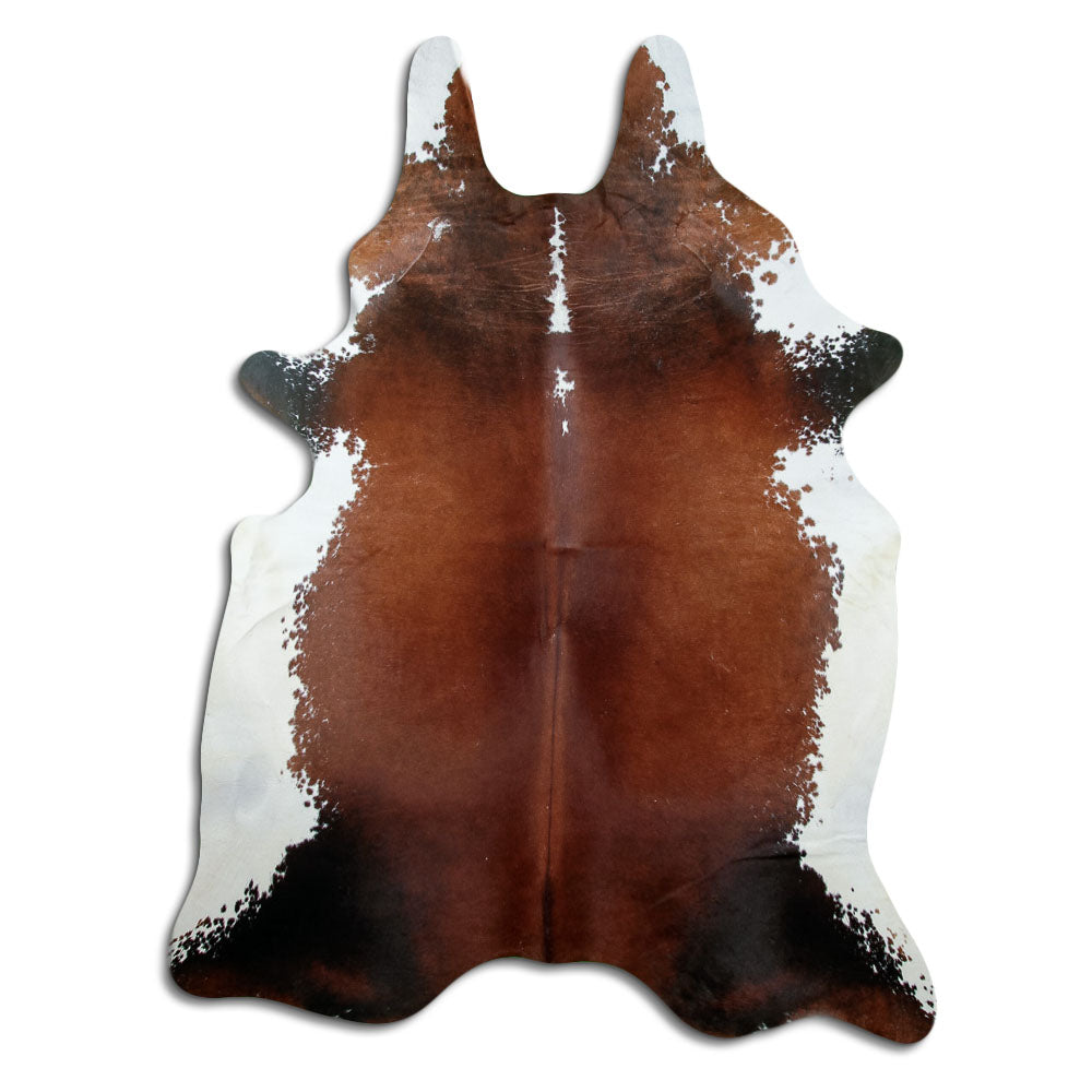 Tricolour cowhide rug of about 230 × 180 cm, seen from above: the exact hide you receive