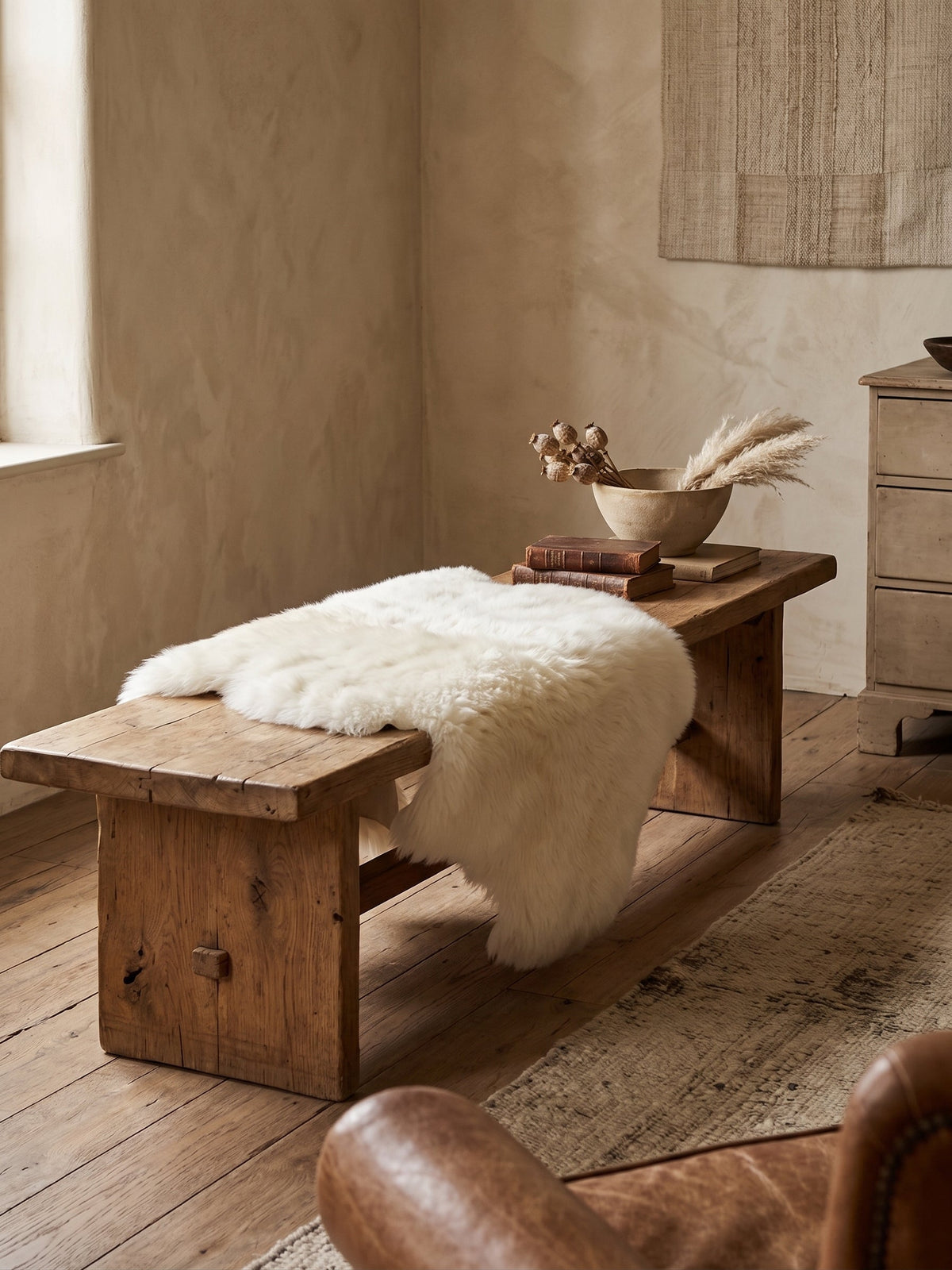 White sheepskin on a low wooden bench
