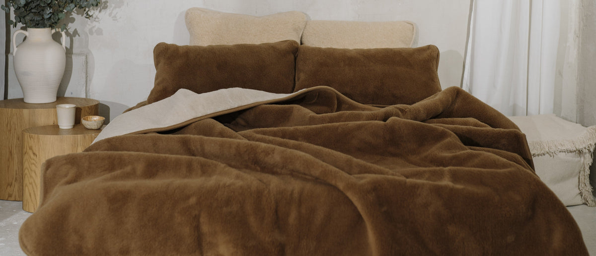 Brown wool blanket on a bed