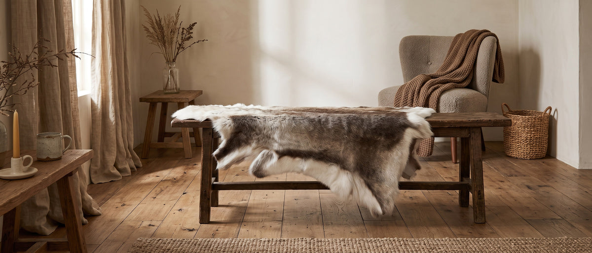 Reindeer hide over an oak bench in a living room