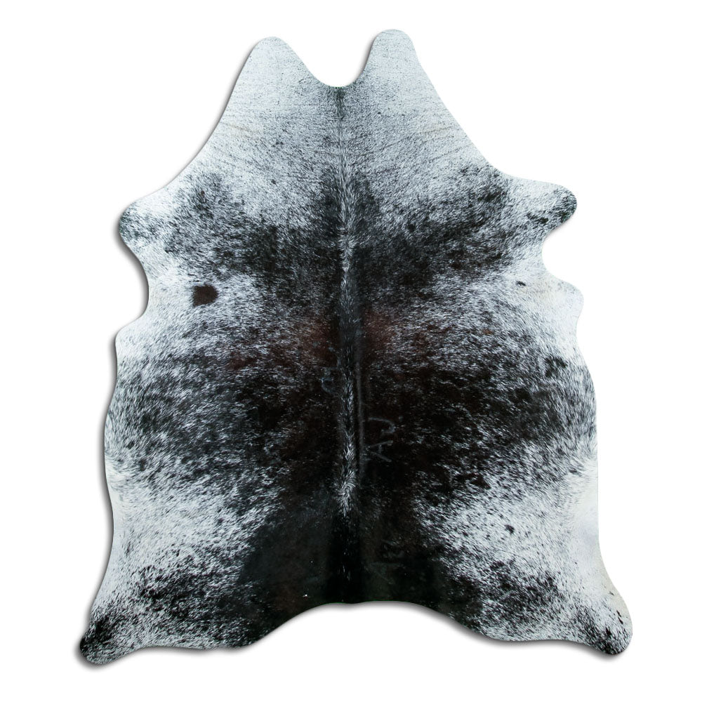 Black and white cowhide rug of about 180 × 160 cm, seen from above: the exact hide you receive