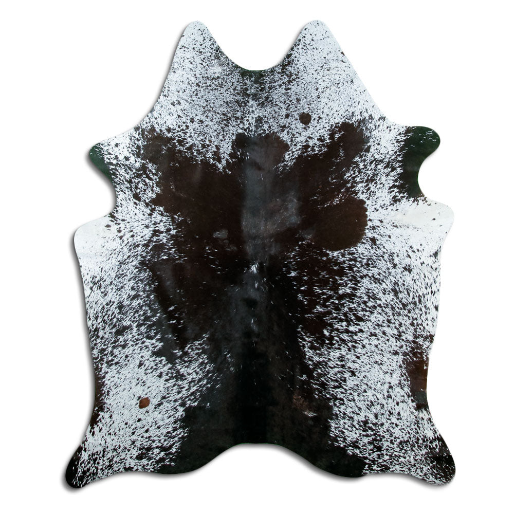 Black and white cowhide rug of about 180 × 150 cm, seen from above: the exact hide you receive