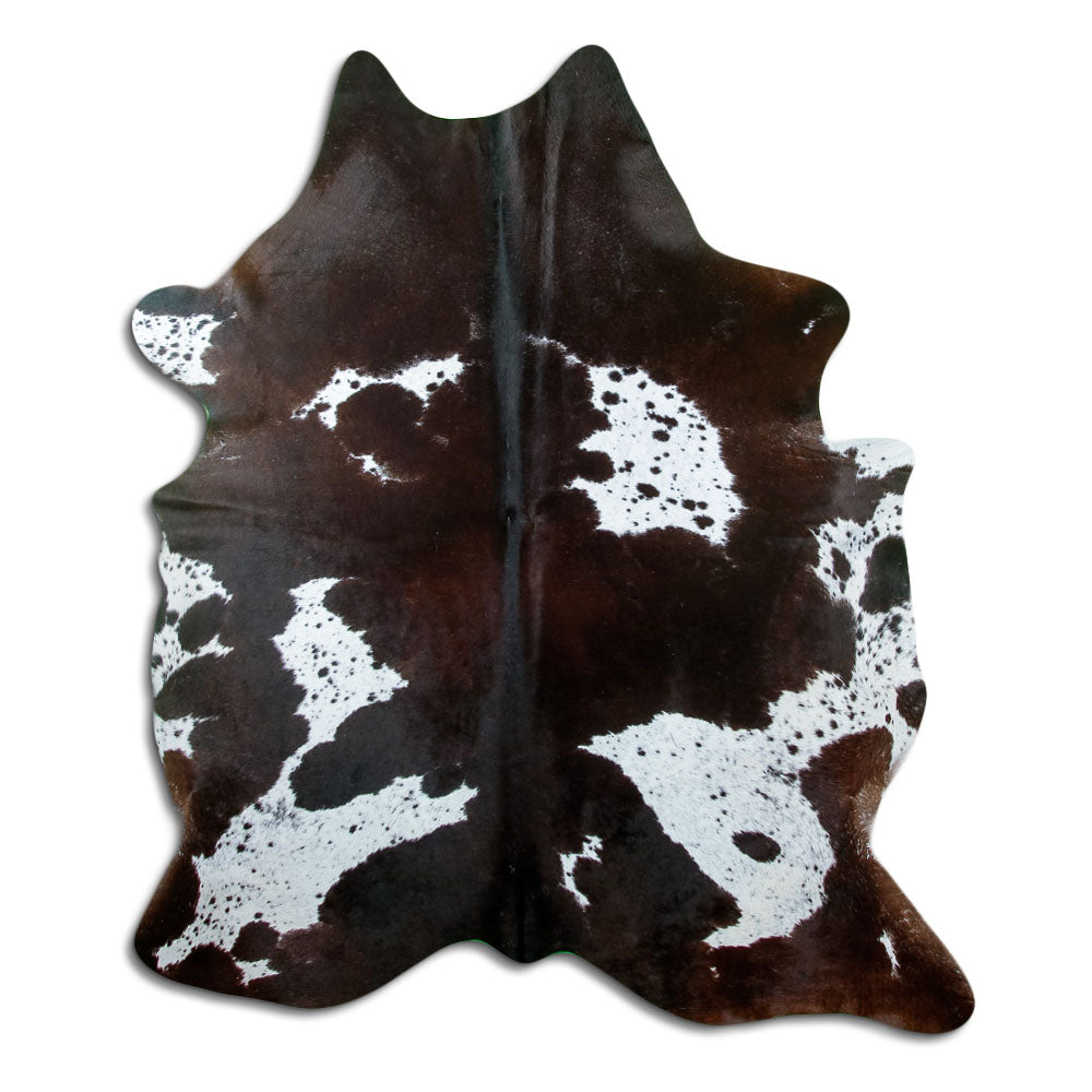 Black and white cowhide rug of about 200 × 170 cm, seen from above: the exact hide you receive