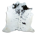 Black and white cowhide rug of about 160 × 160 cm, seen from above: the exact hide you receive