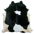 Black and white cowhide rug of about 190 × 180 cm, seen from above: the exact hide you receive