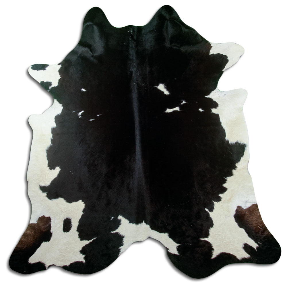 Black and white cowhide rug of about 220 × 210 cm, seen from above: the exact hide you receive