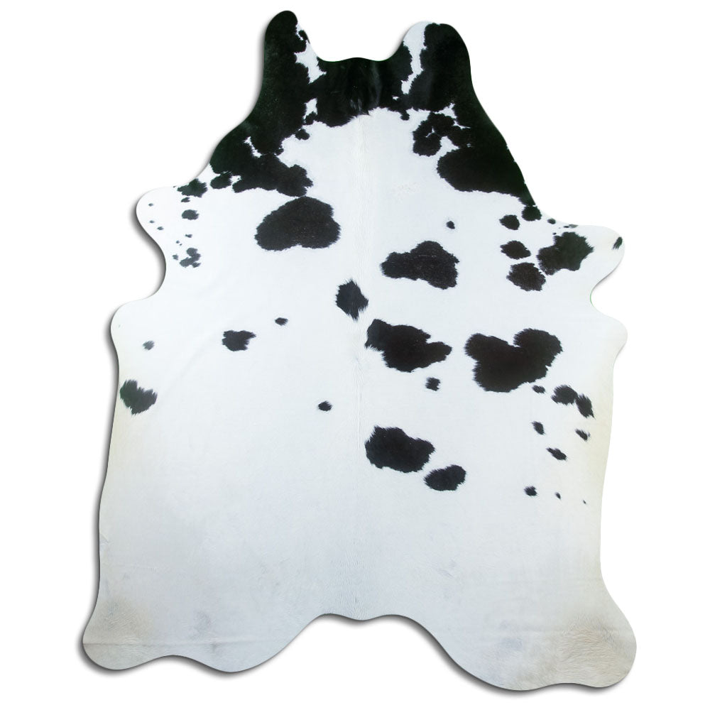 Black and white cowhide rug of about 230 × 190 cm, seen from above: the exact hide you receive