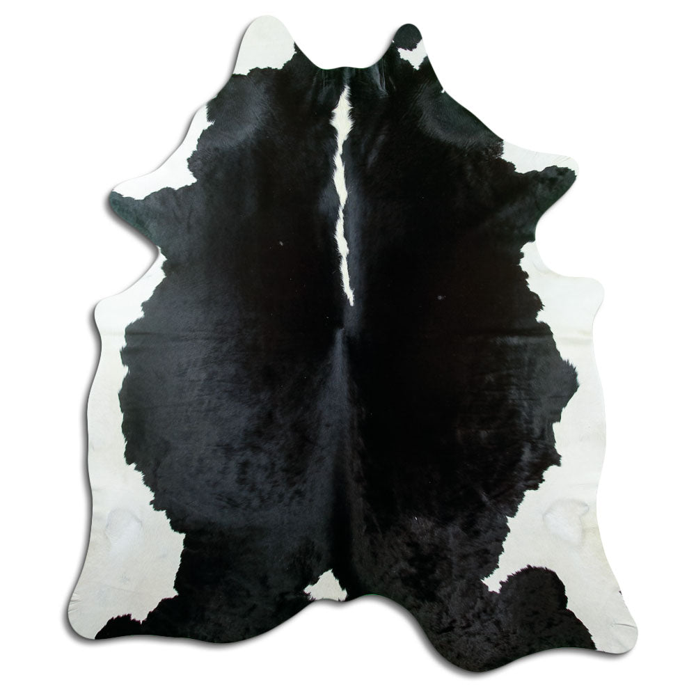 Black and white cowhide rug of about 220 × 200 cm, seen from above: the exact hide you receive