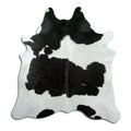 Black and white cowhide rug of about 200 × 200 cm, seen from above: the exact hide you receive