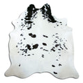 Black and white cowhide rug of about 200 × 200 cm, seen from above: the exact hide you receive