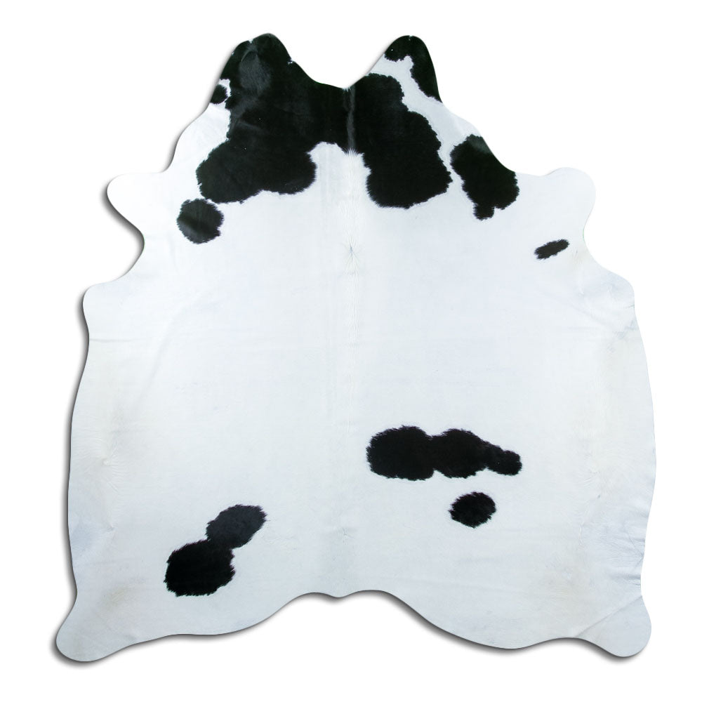 Black and white cowhide rug of about 200 × 180 cm, seen from above: the exact hide you receive