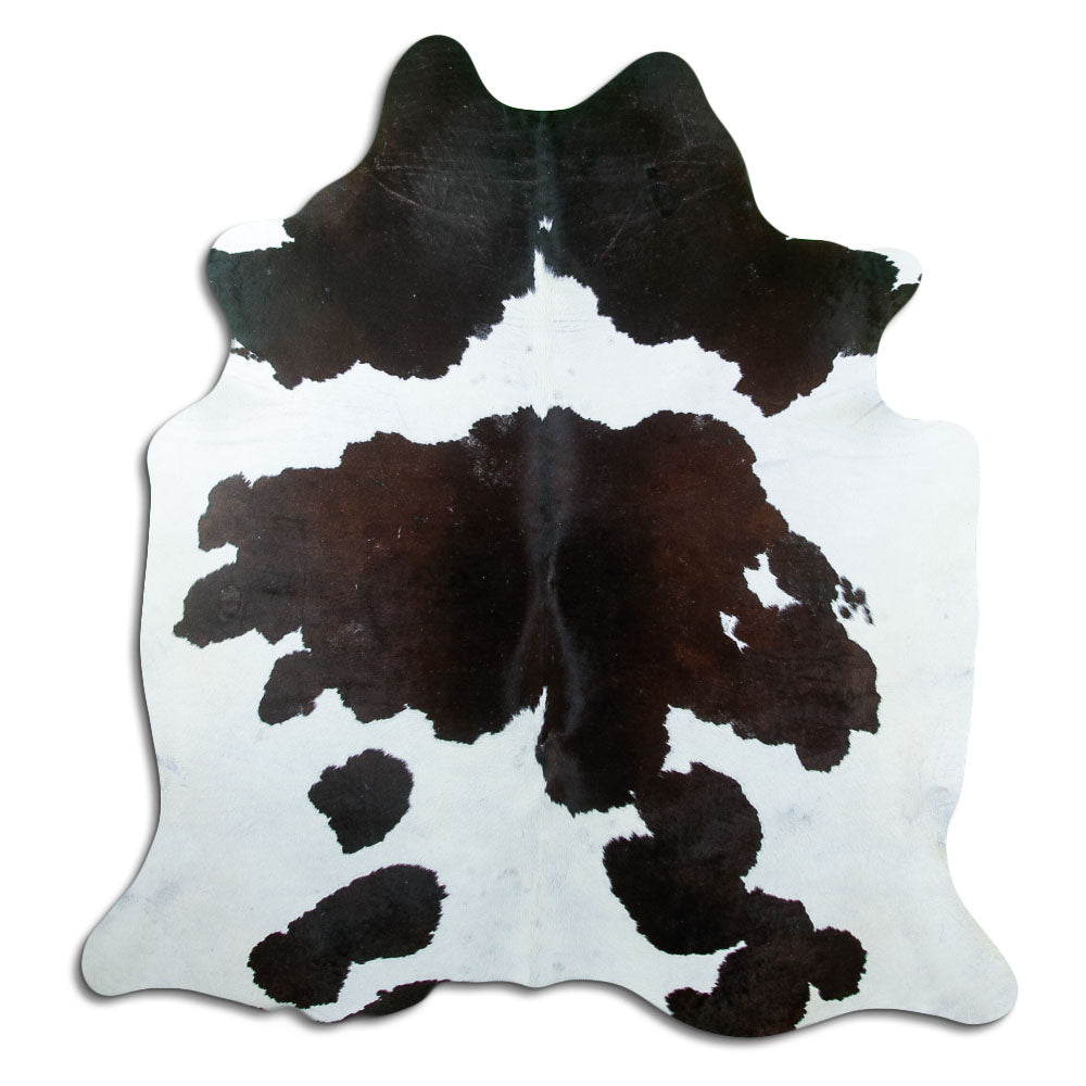 Black and white cowhide rug of about 200 × 190 cm, seen from above: the exact hide you receive