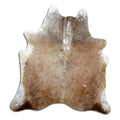 Brown and white cowhide rug of about 190 × 180 cm, seen from above: the exact hide you receive