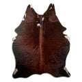 Brown and white cowhide rug of about 200 × 160 cm, seen from above: the exact hide you receive