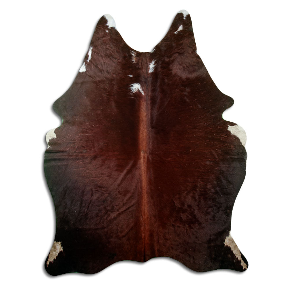 Brown and white cowhide rug of about 200 × 160 cm, seen from above: the exact hide you receive