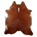 Brown and white cowhide rug of about 210 × 180 cm, seen from above: the exact hide you receive