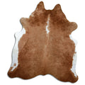 Brown and white cowhide rug of about 220 × 190 cm, seen from above: the exact hide you receive