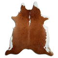 Brown and white cowhide rug of about 220 × 200 cm, seen from above: the exact hide you receive