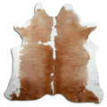 Brown and white cowhide rug of about 200 × 200 cm, seen from above: the exact hide you receive