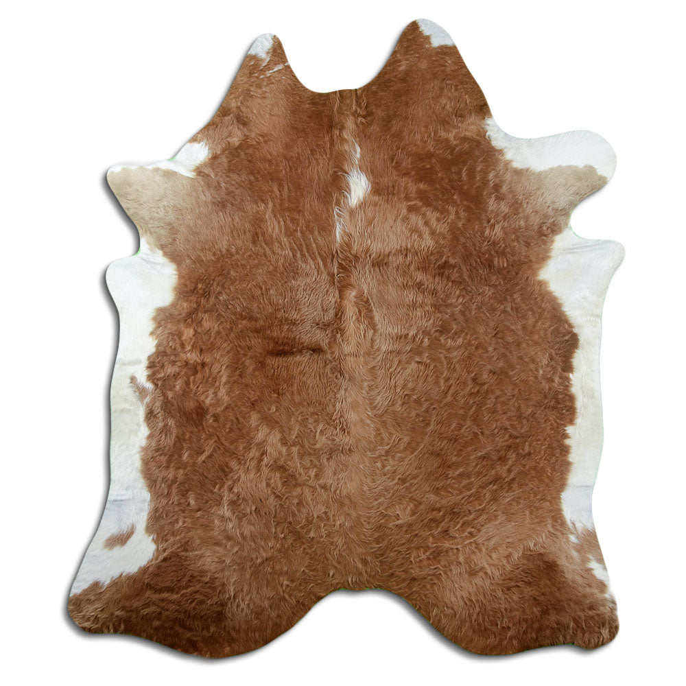 Brown and white cowhide rug of about 220 × 190 cm, seen from above: the exact hide you receive