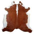 Brown and white cowhide rug of about 210 × 200 cm, seen from above: the exact hide you receive