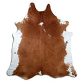 Brown and white cowhide rug of about 240 × 220 cm, seen from above: the exact hide you receive