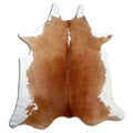 Brown and white cowhide rug of about 230 × 210 cm, seen from above: the exact hide you receive