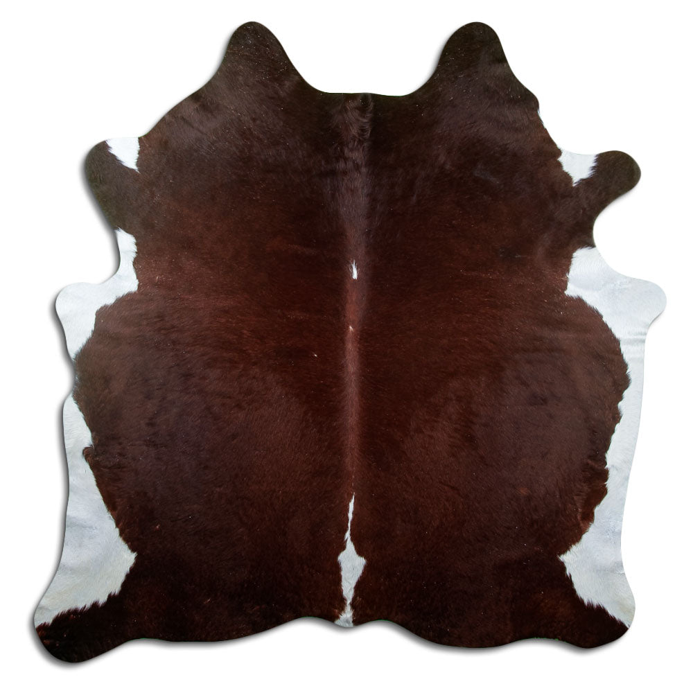Brown and white cowhide rug of about 210 × 200 cm, seen from above: the exact hide you receive