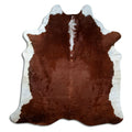 Brown and white cowhide rug of about 210 × 200 cm, seen from above: the exact hide you receive