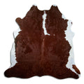 Brown and white cowhide rug of about 210 × 210 cm, seen from above: the exact hide you receive