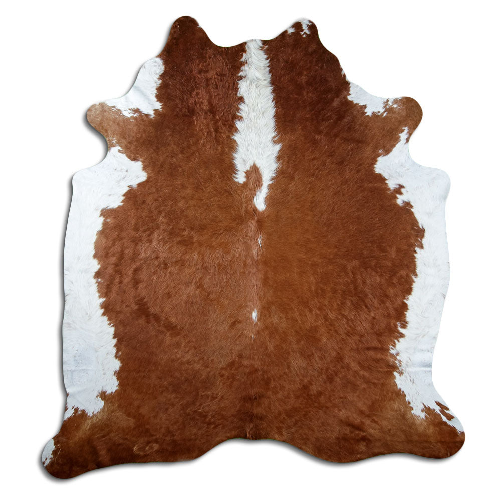 Brown and white cowhide rug of about 220 × 200 cm, seen from above: the exact hide you receive
