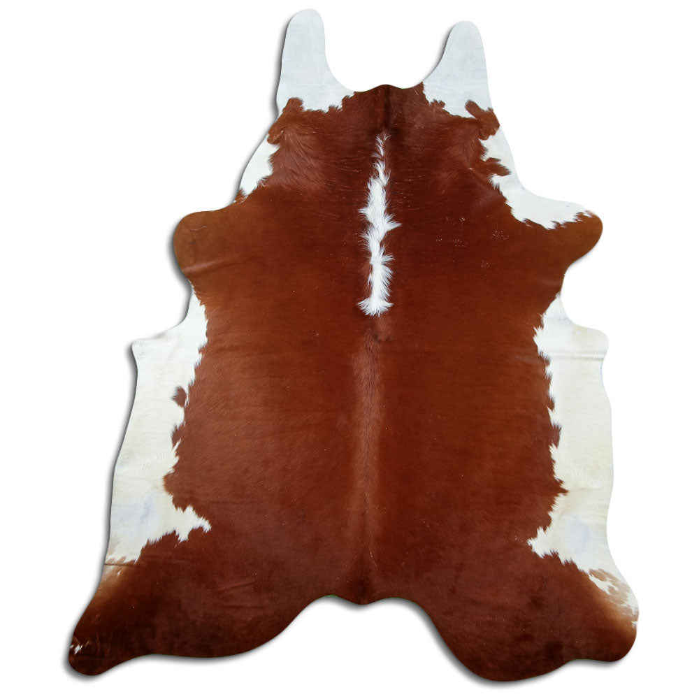 Brown and white cowhide rug of about 230 × 190 cm, seen from above: the exact hide you receive