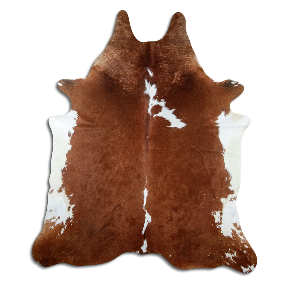 Brown and white cowhide rug of about 220 × 200 cm, seen from above: the exact hide you receive