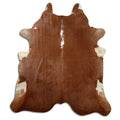 Brown and white cowhide rug of about 230 × 210 cm, seen from above: the exact hide you receive