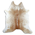 Brown and white cowhide rug of about 190 × 180 cm, seen from above: the exact hide you receive