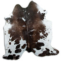 Brown and white cowhide rug of about 180 × 170 cm, seen from above: the exact hide you receive