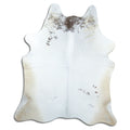 Brown and white cowhide rug of about 200 × 170 cm, seen from above: the exact hide you receive