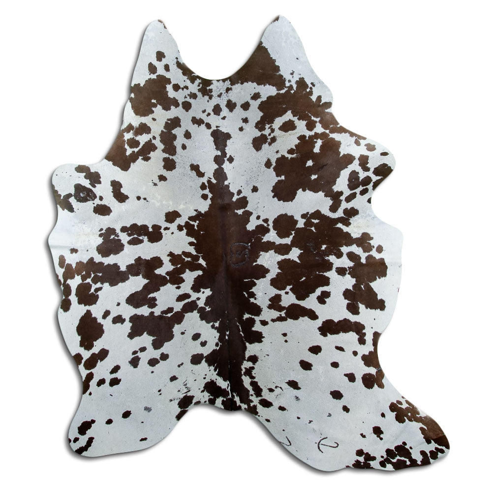Brown and white cowhide rug of about 190 × 160 cm, seen from above: the exact hide you receive